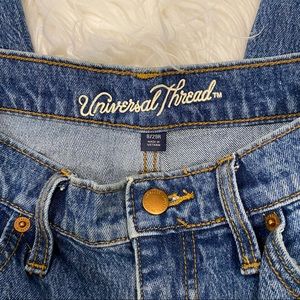 Distressed universal thread jeans
